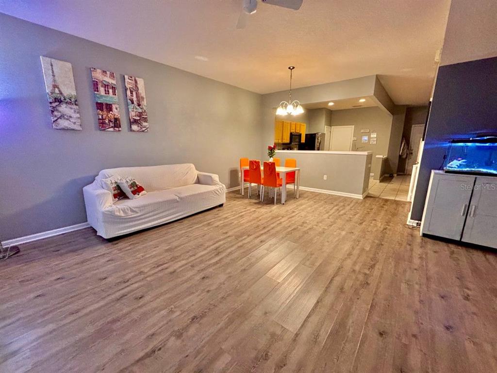 26618 Castleview Way Wesley Chapel, FL 33544 - Photo 2 of 29 a living room with furniture and wooden floor