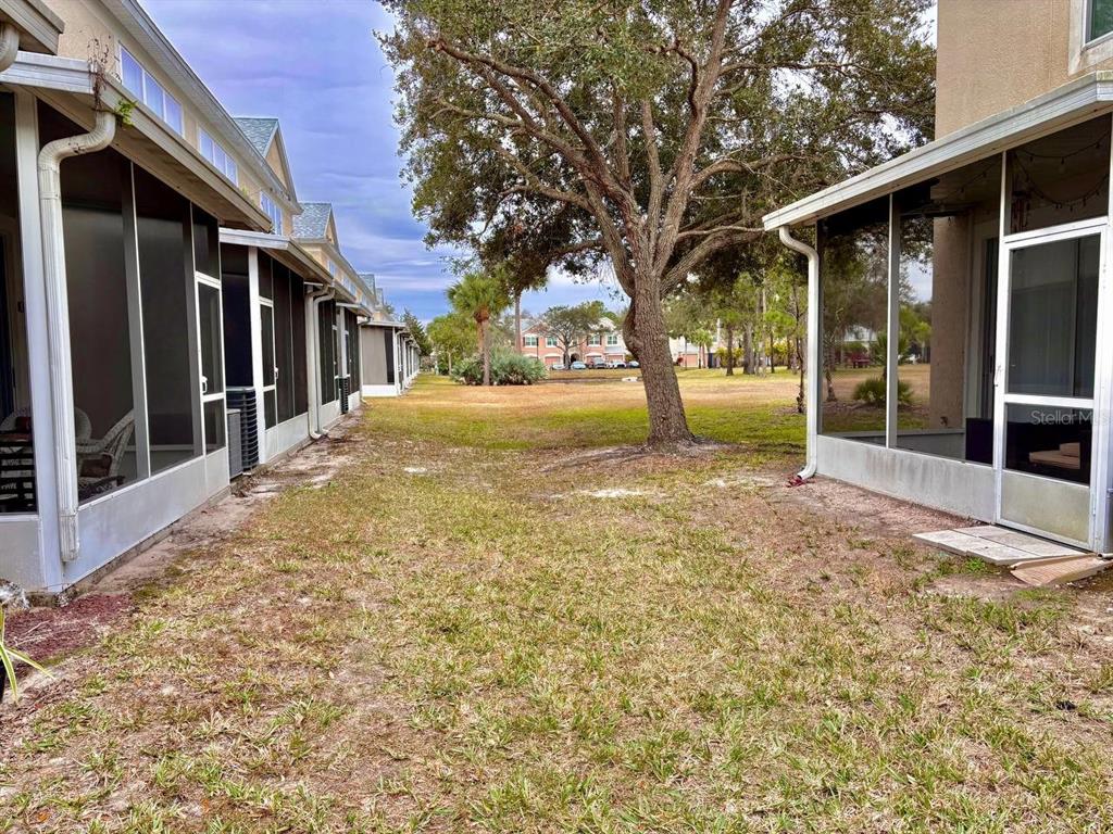 26618 Castleview Way Wesley Chapel, FL 33544 - Photo 22 of 29 a view of a house with yard and tree s
