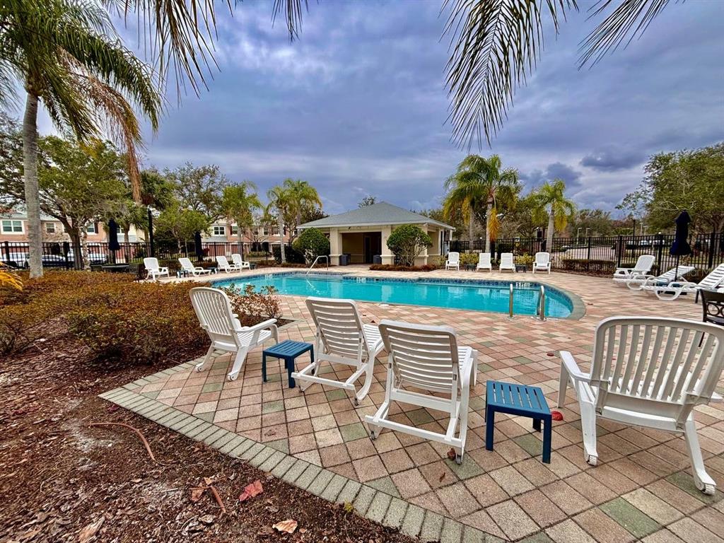 26618 Castleview Way Wesley Chapel, FL 33544 - Photo 25 of 29 a view of a patio with a table and chairs