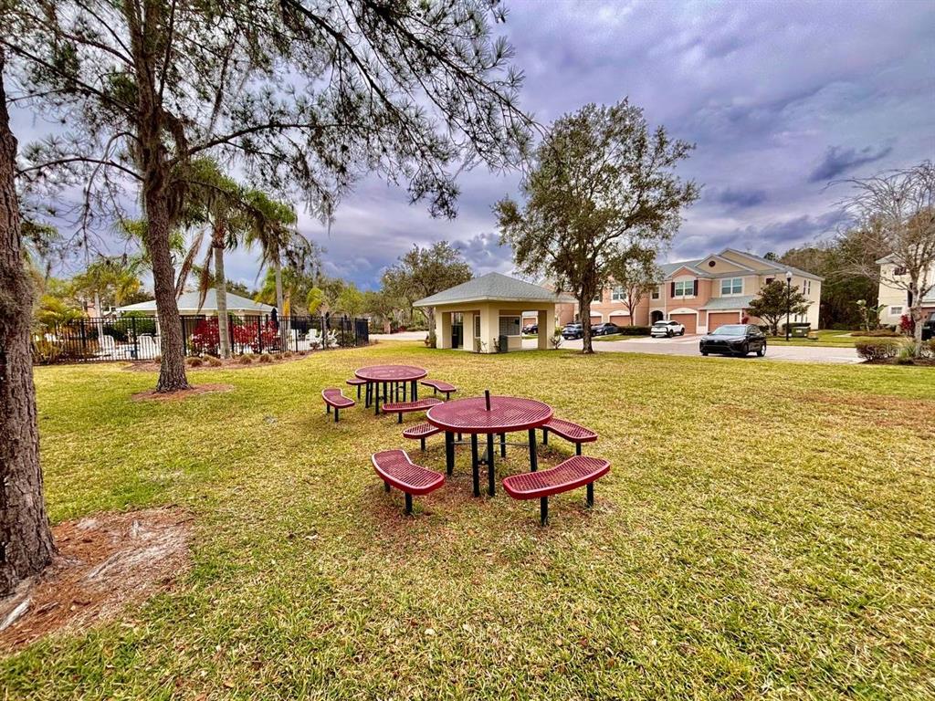 26618 Castleview Way Wesley Chapel, FL 33544 - Photo 27 of 29 a swimming pool with outdoor seating and yard
