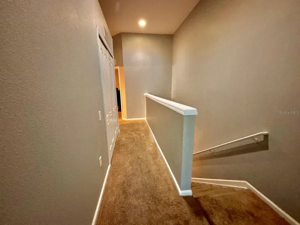a view of a hallway with entryway