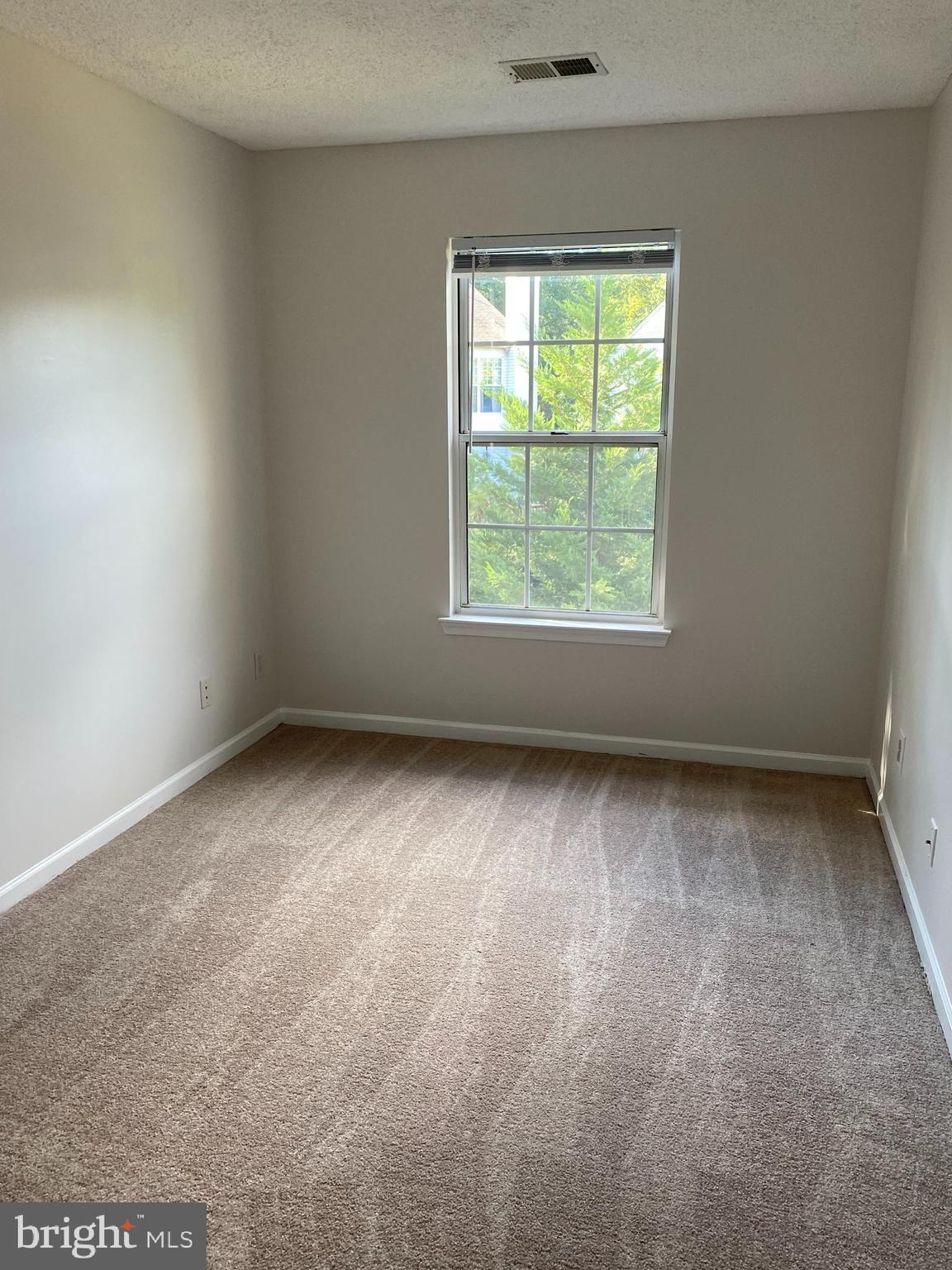 12106 Greenway Court, Unit 302 Fairfax, VA 22033 - Photo 14 of 20 an empty room with a window
