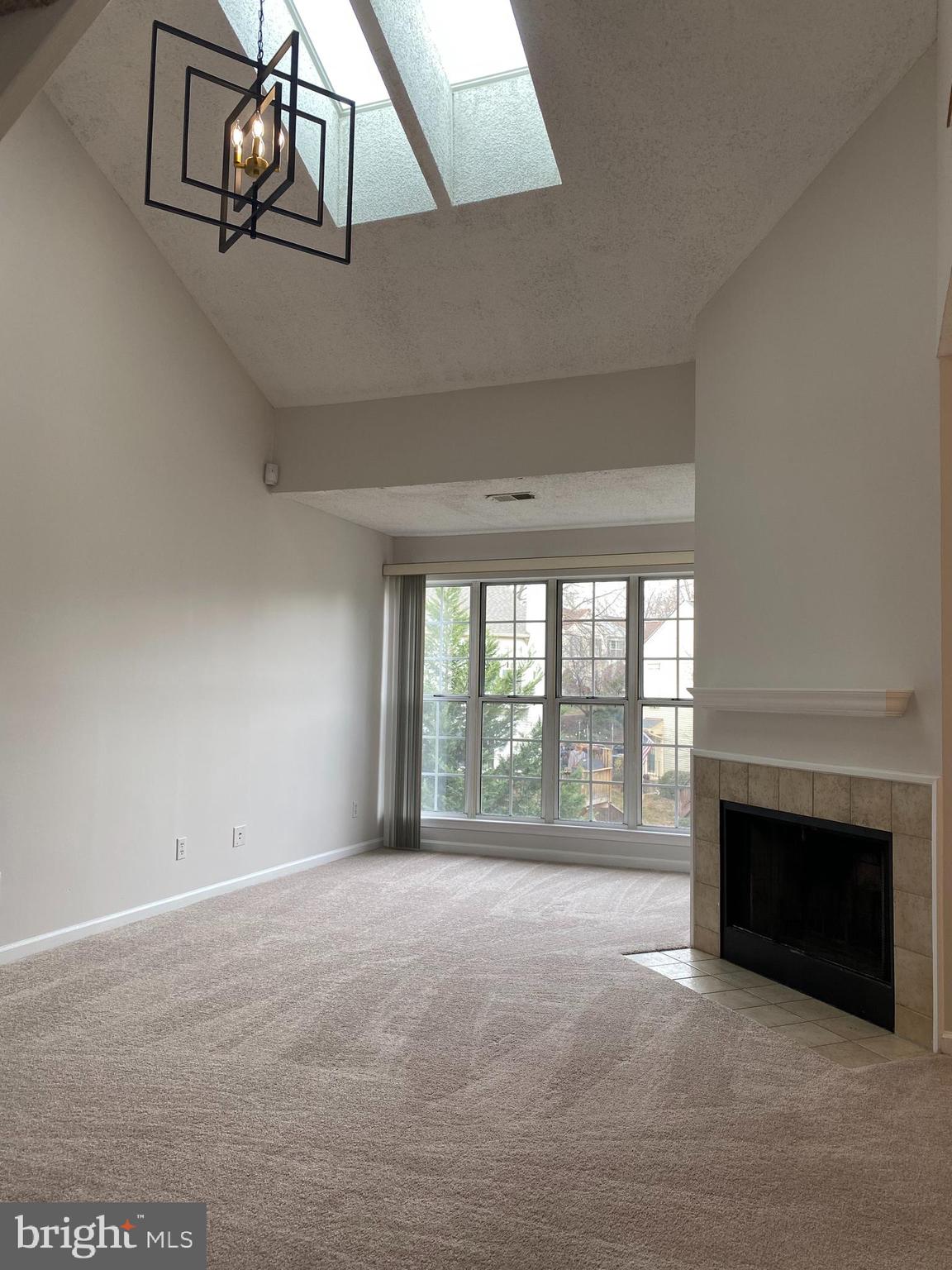12106 Greenway Court, Unit 302 Fairfax, VA 22033 - Photo 20 of 20 a view of an empty room with a fireplace