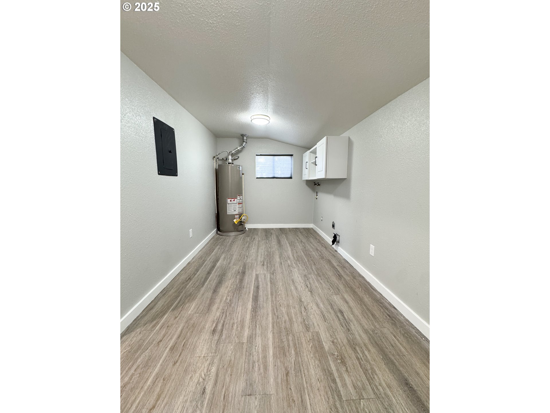 971 Walnut Street Baker City, OR 97814 - Photo 15 of 19 a view of a room with wooden floor