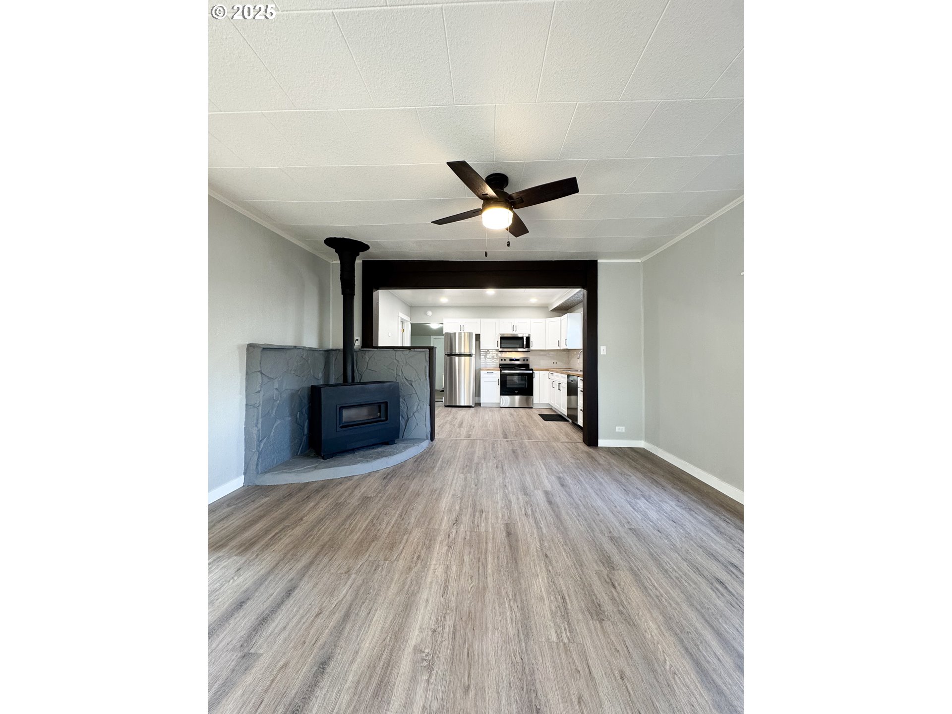 971 Walnut Street Baker City, OR 97814 - Photo 2 of 19 a living room with furniture and a fireplace