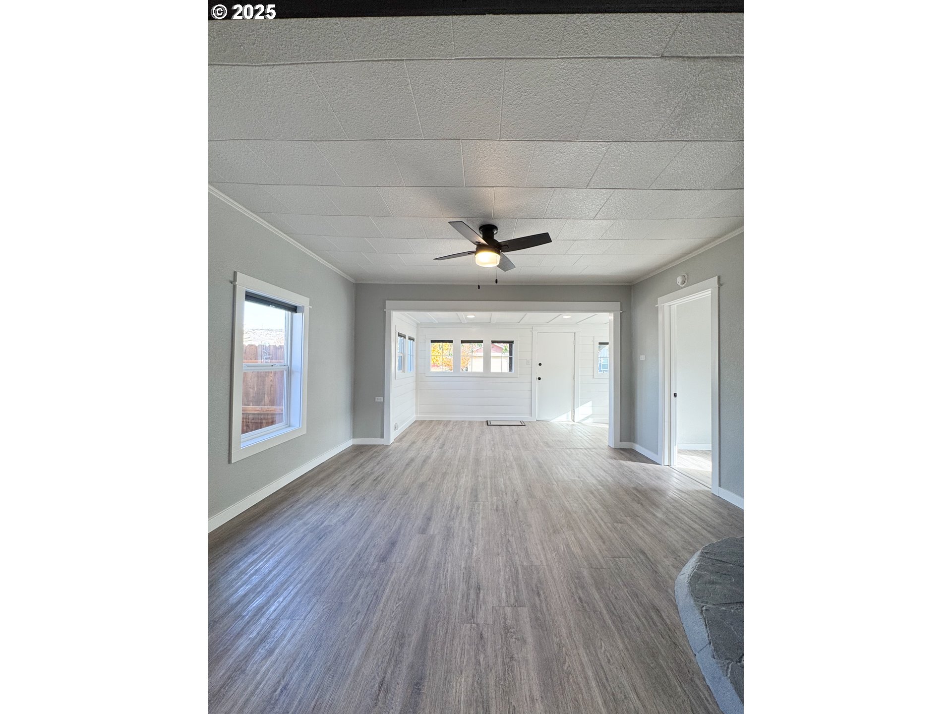 971 Walnut Street Baker City, OR 97814 - Photo 3 of 19 a view of an empty room and window