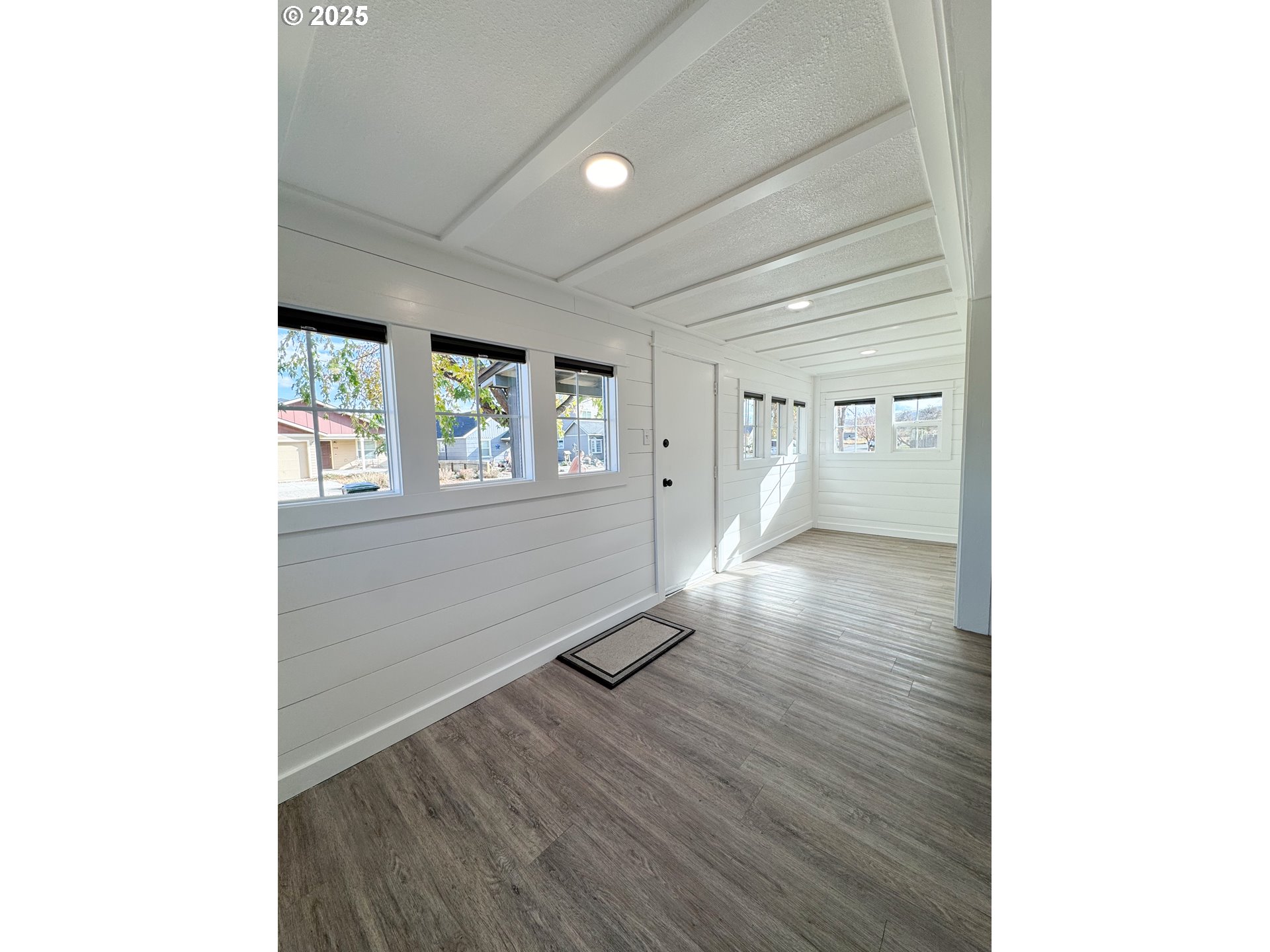 971 Walnut Street Baker City, OR 97814 - Photo 5 of 19 a view of a livingroom with wooden floor and window
