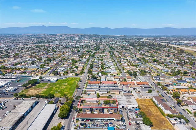 an aerial view of residential houses and city view