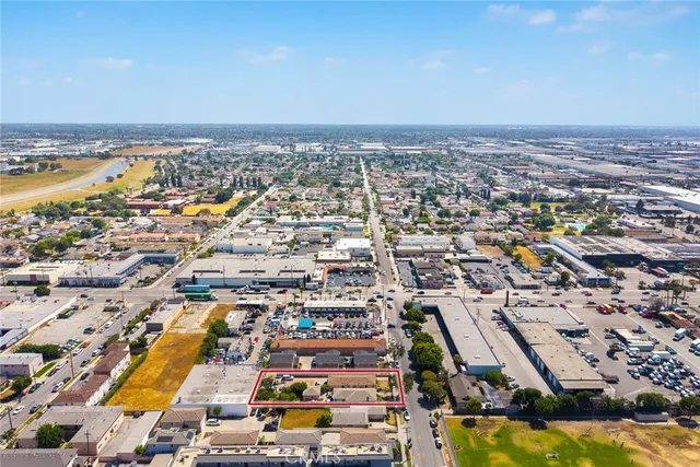 an aerial view of residential building and lake