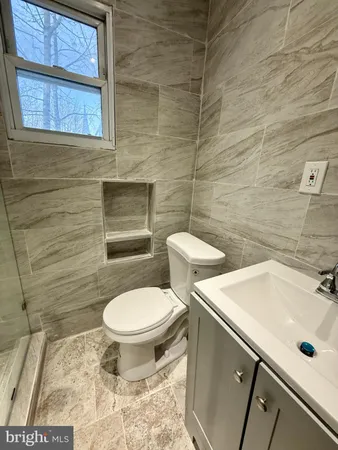 a bathroom with a toilet and a sink