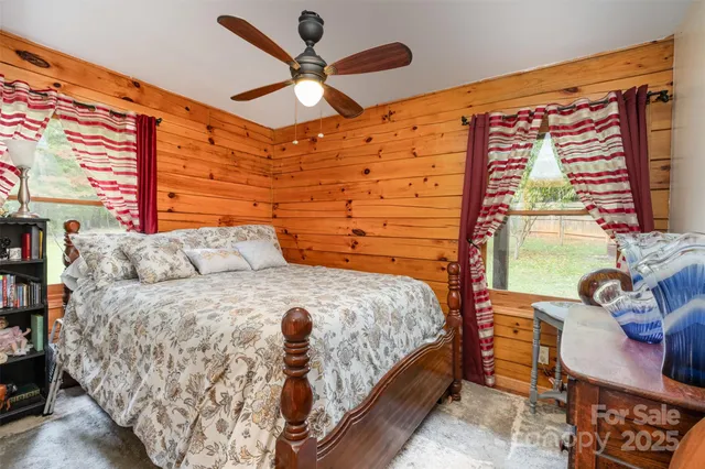 a bedroom with furniture and wooden floor