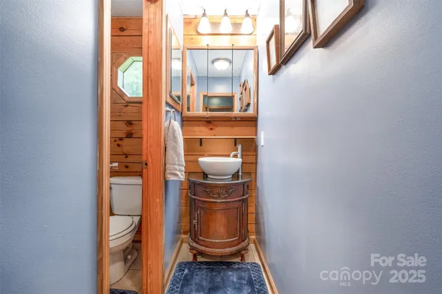 a living room with furniture a fireplace and a window