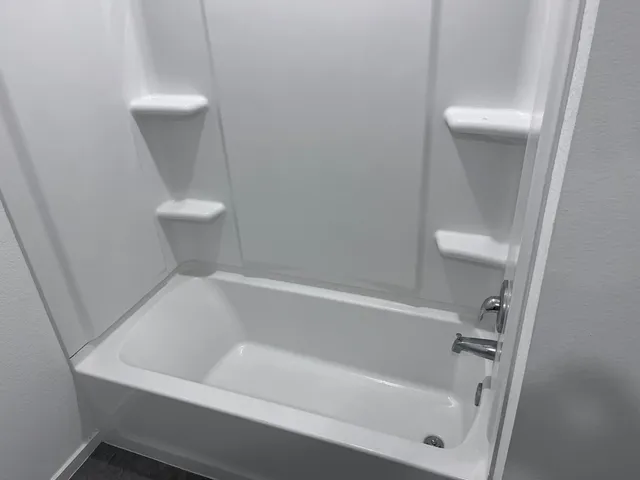 a view of storage and utility room with racks on the wall