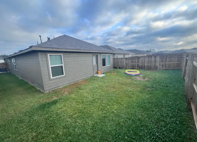 a view of a small fountain in the middle of a garden