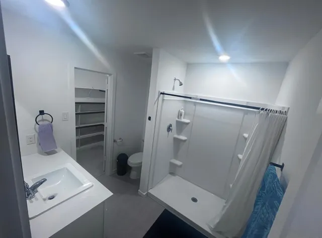 a bathroom with a sink and toilet