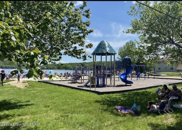 a view of a lake with houses in the back