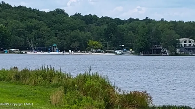 a view of a lake with a yard