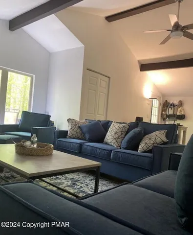a living room with furniture and a window