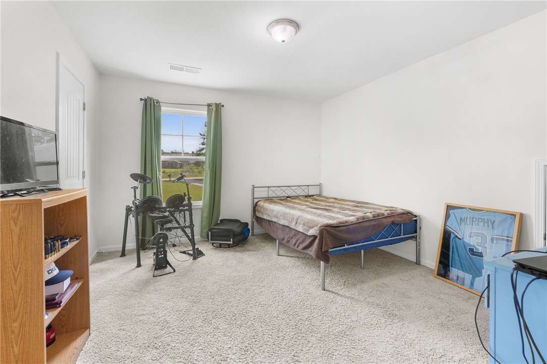 768 Rocky Ridge Circle Seneca, SC 29678 - Photo 20 of 30 A quiet secondary bedroom offers a peaceful retreat with soft carpeting and natural illumination.