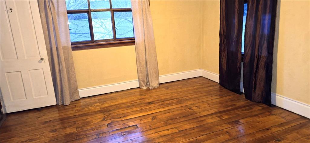 64 Old Rte 36 Road Punxsutawney, PA 15767 - Photo 11 of 12 a view of an empty room with wooden floor and a window