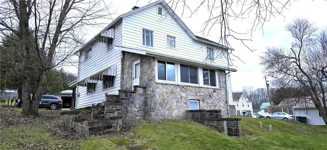 a front view of a house with a yard