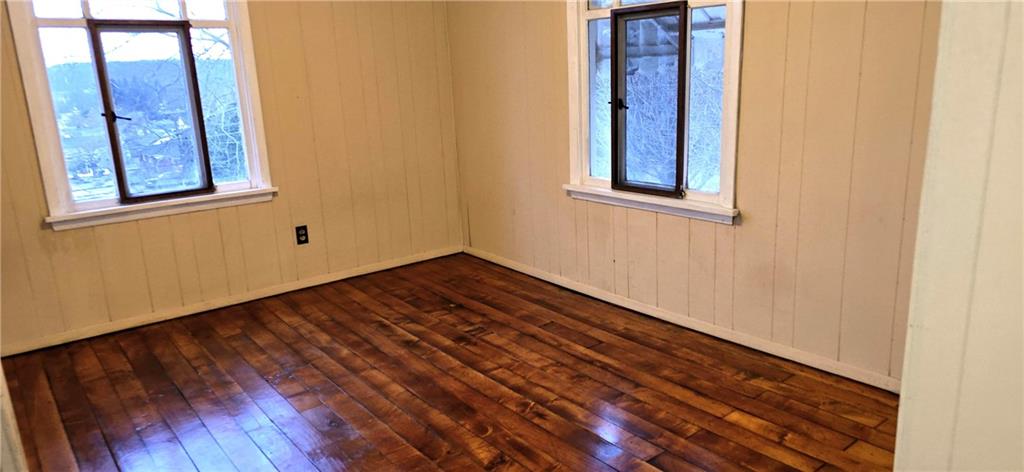 64 Old Rte 36 Road Punxsutawney, PA 15767 - Photo 10 of 12 a view of an empty room with wooden floor and a window