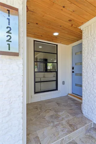 a kitchen with a kitchen island wooden cabinets and center island