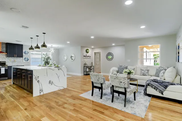 a large kitchen with lots of counter space and stainless steel appliances