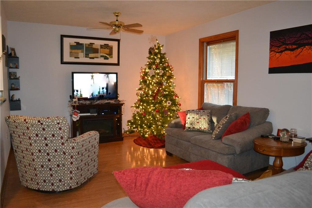 9252 Highland Road Pittsburgh, PA 15237 - Photo 2 of 17 15x11 Living room with ceiling fan and hardwood floors.