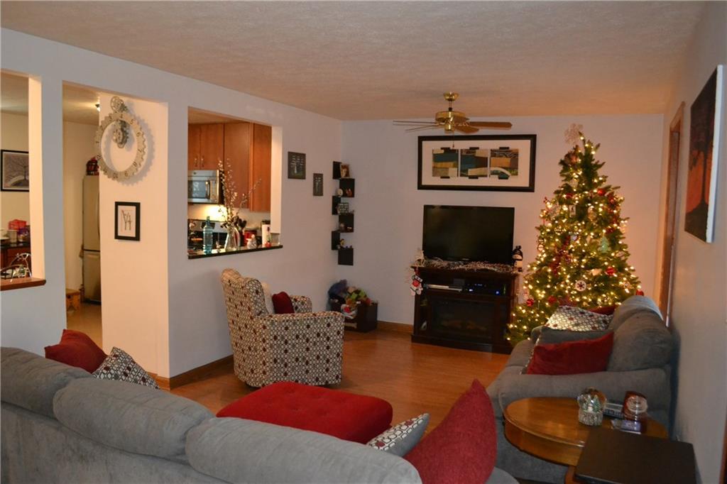 9252 Highland Road Pittsburgh, PA 15237 - Photo 3 of 17 The open concept main floor features hardwood flooring and sliders to the outside.