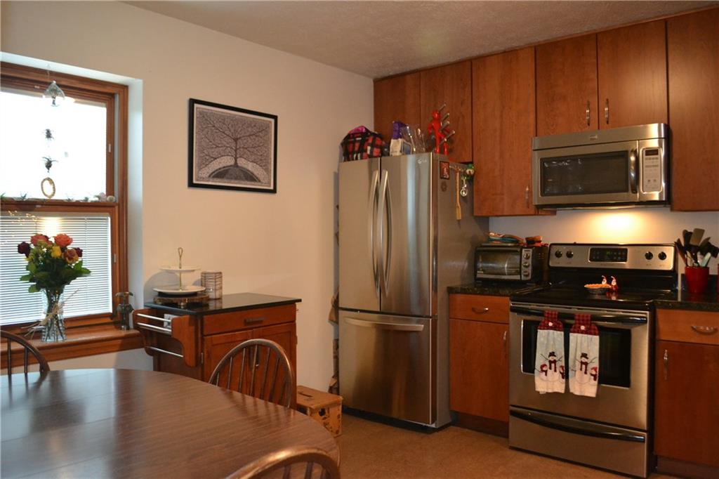 9252 Highland Road Pittsburgh, PA 15237 - Photo 6 of 17 The 12x11 kitchen features cork flooring, stainless steel appliances and soft close drawers.