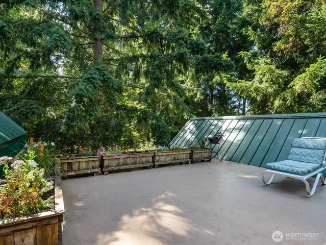 a bed sitting in a room next to a window