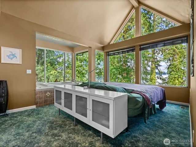 a bath tub sitting in front of a green space