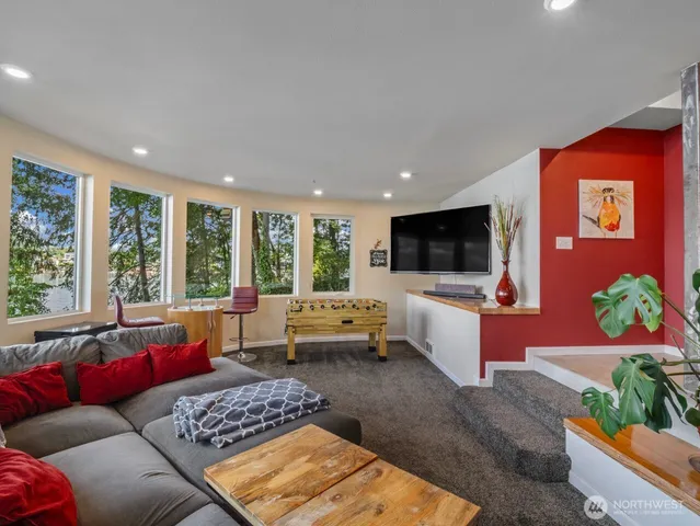 a view of house with backyard outdoor seating and green space