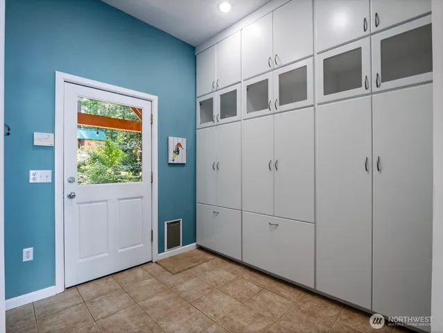 a kitchen with granite countertop a sink and cabinets