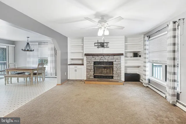 a kitchen with granite countertop a stove a sink and a refrigerator