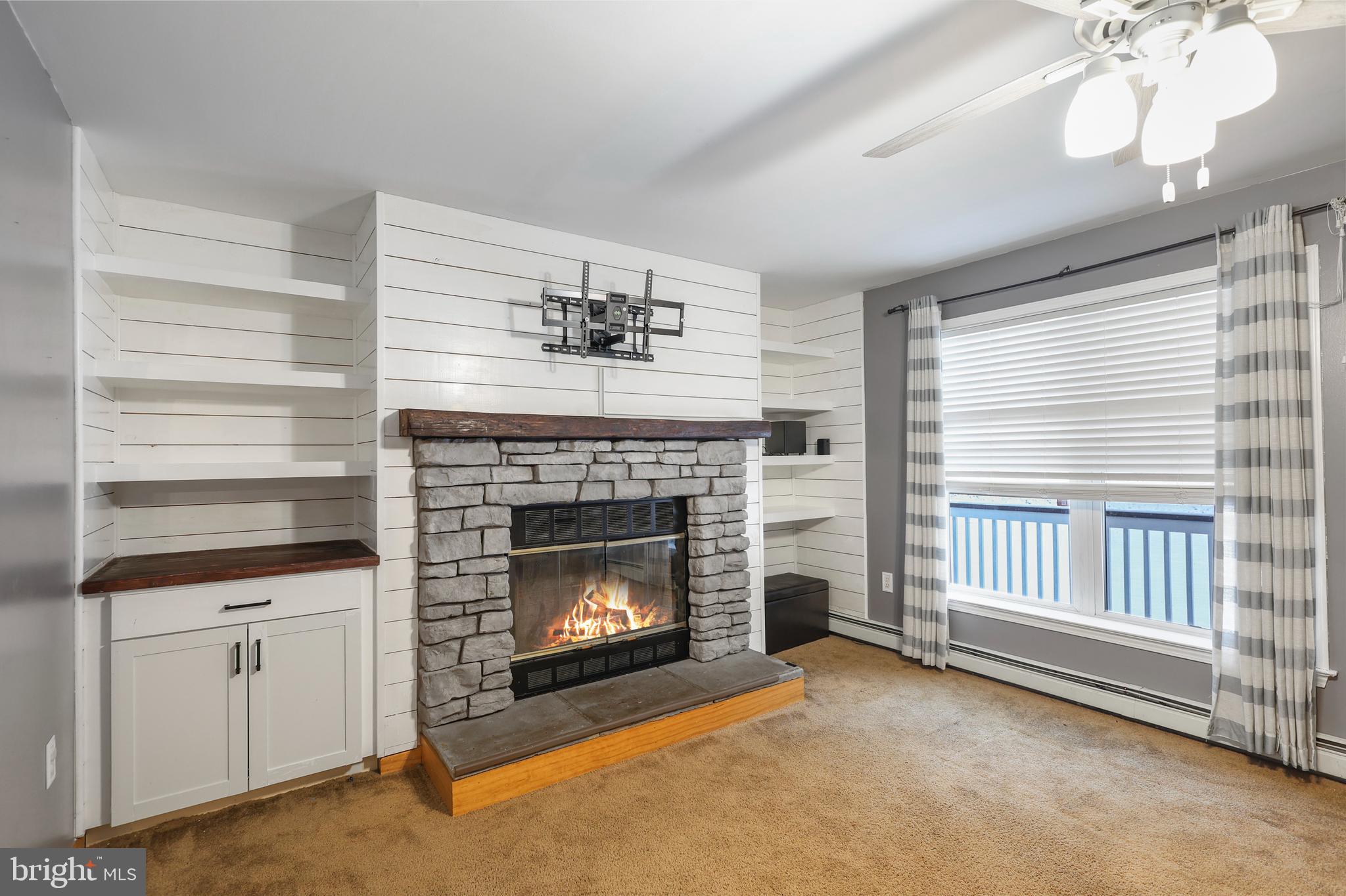 2021 Frostburg Road Frostburg, MD 21532 - Photo 17 of 67 a living room with furniture and a fireplace