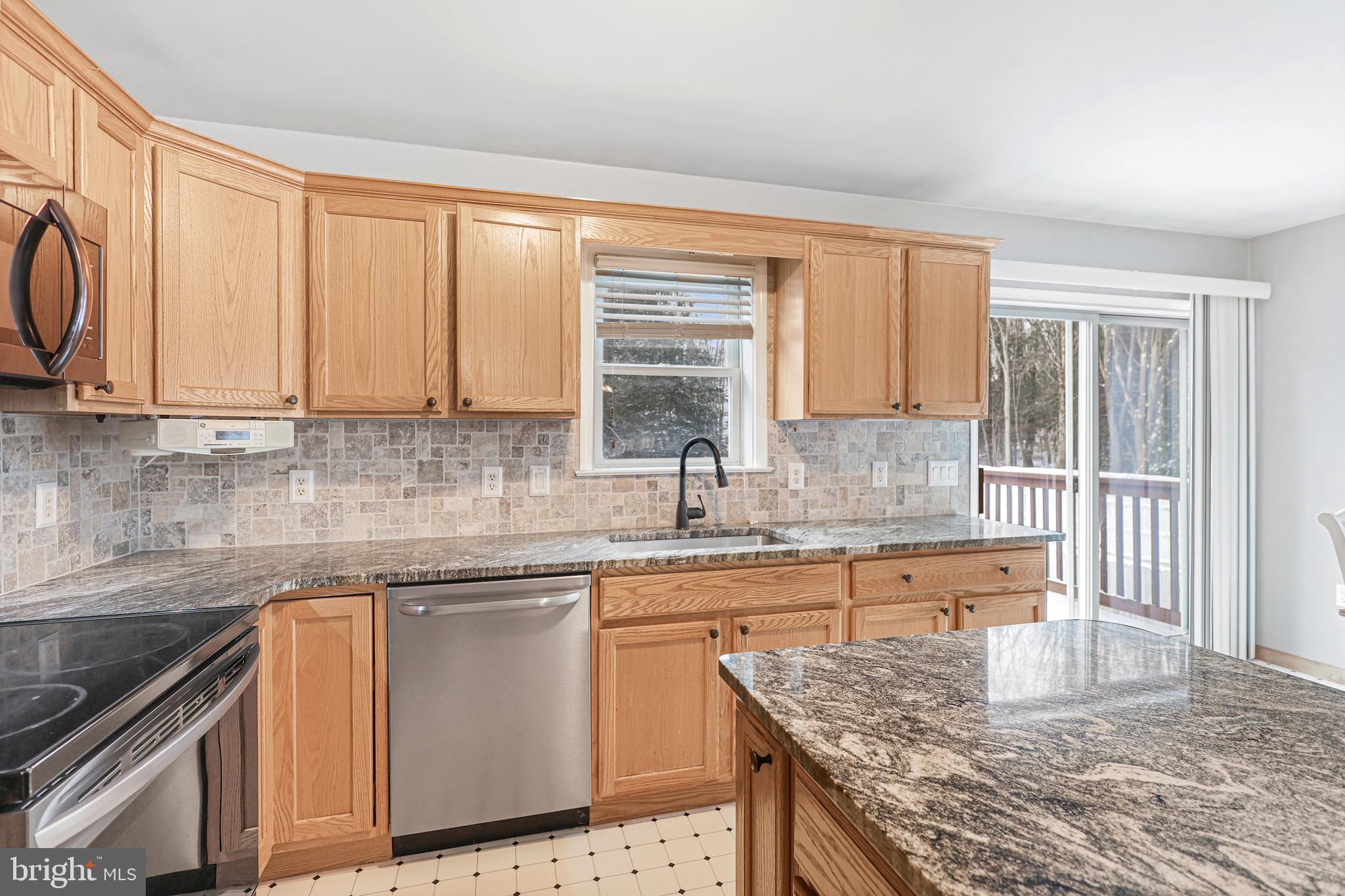 2021 Frostburg Road Frostburg, MD 21532 - Photo 21 of 67 a kitchen with stainless steel appliances granite countertop a sink stove and cabinets