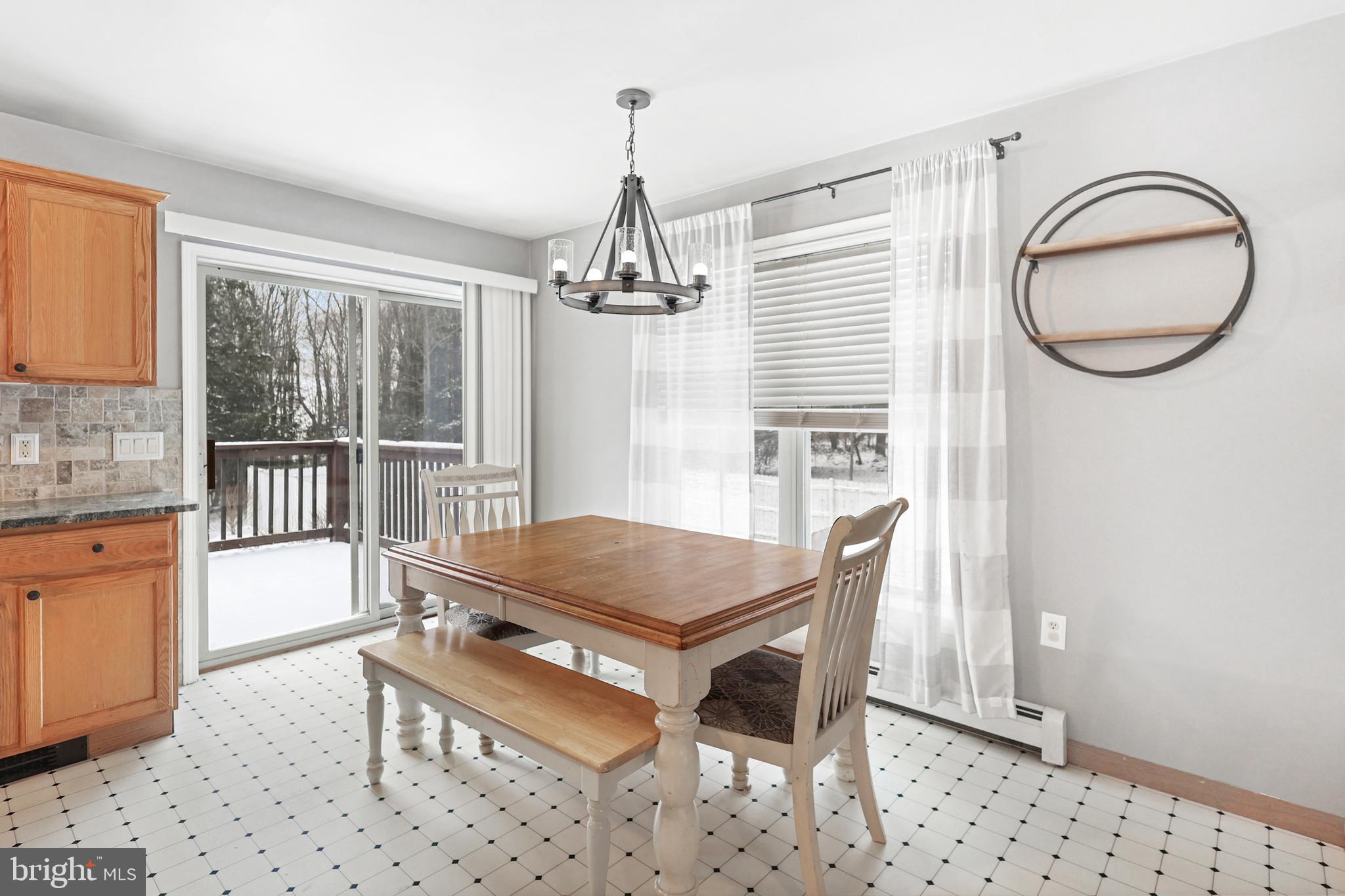 2021 Frostburg Road Frostburg, MD 21532 - Photo 23 of 67 a living room with furniture a window and a chandelier