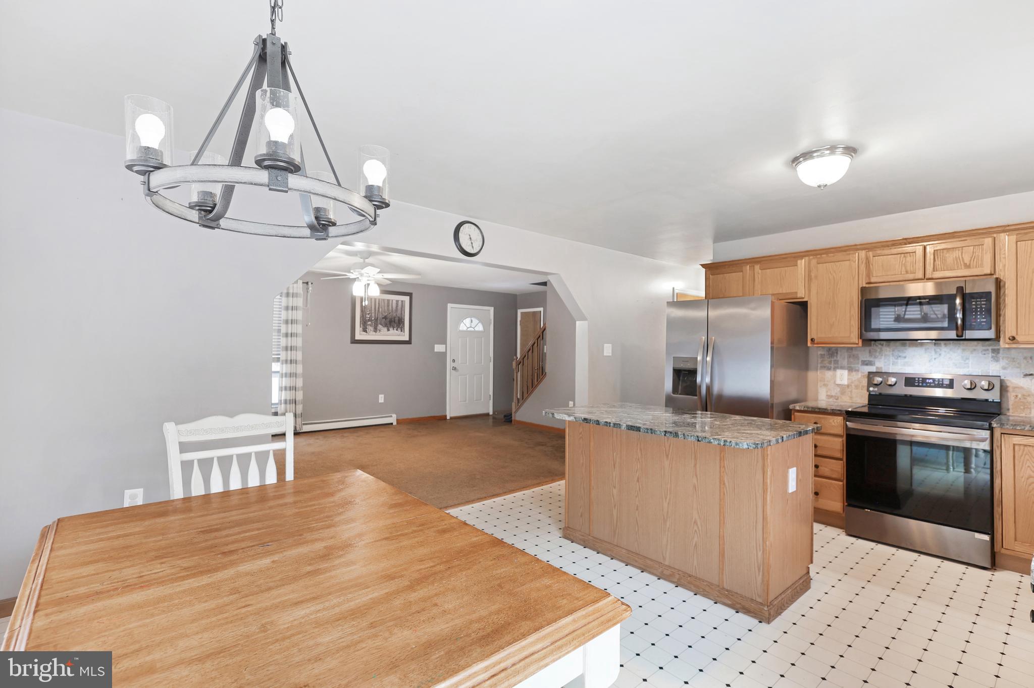 2021 Frostburg Road Frostburg, MD 21532 - Photo 24 of 67 a kitchen with stainless steel appliances granite countertop a sink and stove