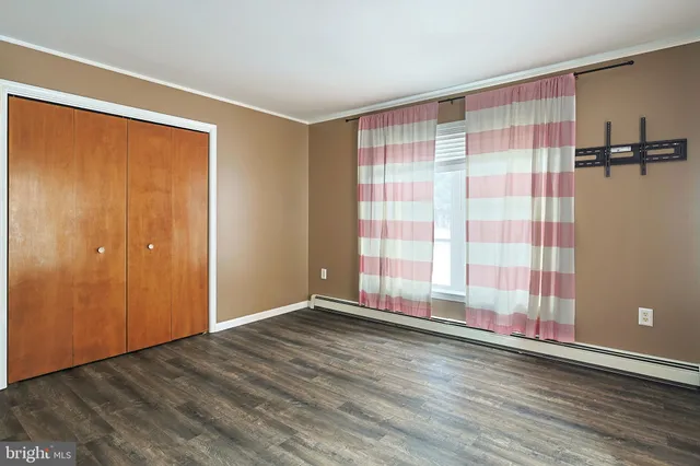 a bathroom with a granite countertop tub sink and mirror