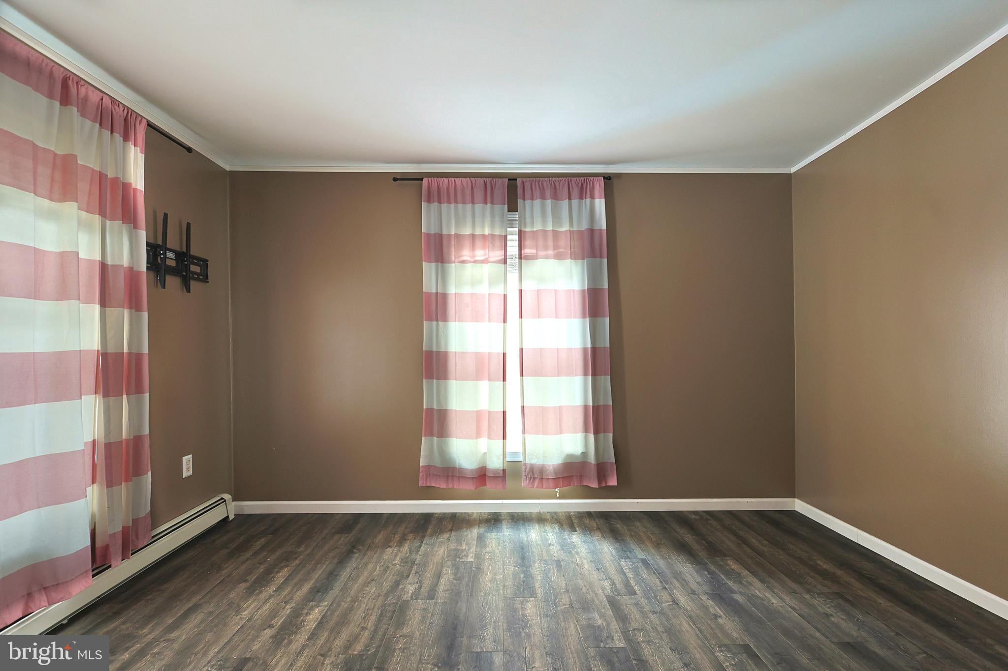 2021 Frostburg Road Frostburg, MD 21532 - Photo 32 of 67 a view of an empty room with wooden floor and a window