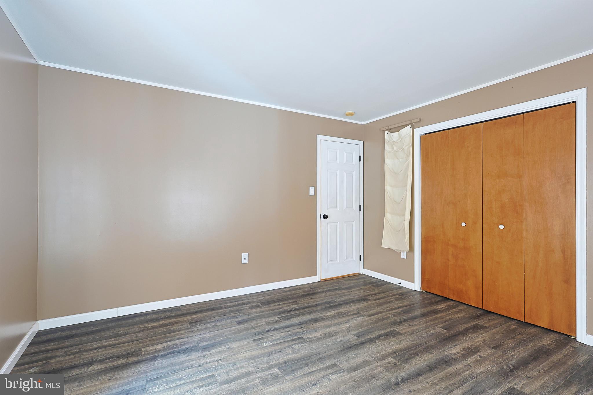 2021 Frostburg Road Frostburg, MD 21532 - Photo 33 of 67 a view of an empty room with wooden floor and a window