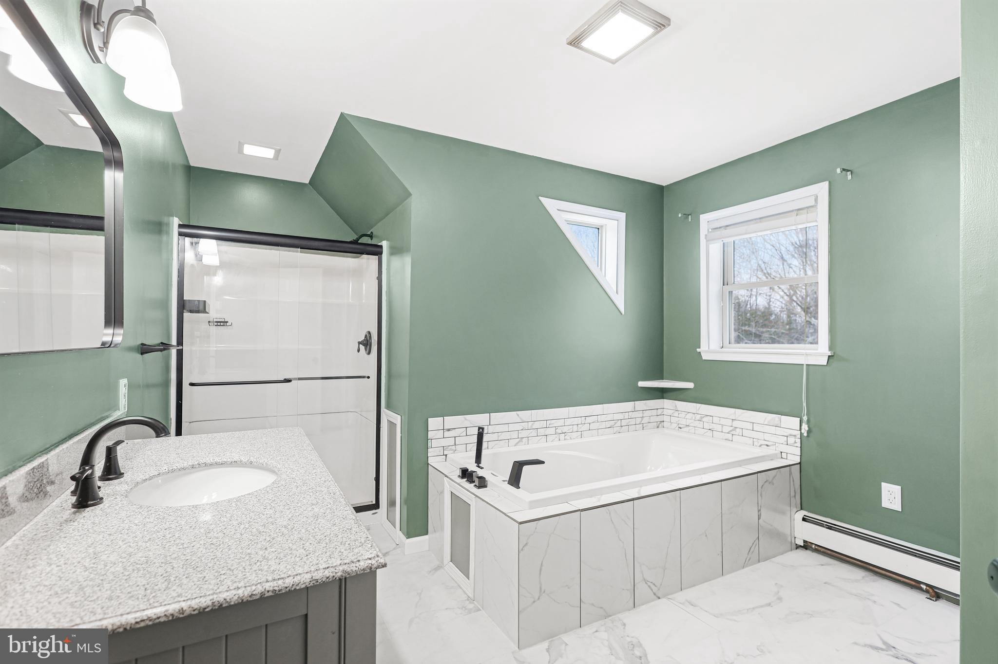 2021 Frostburg Road Frostburg, MD 21532 - Photo 34 of 67 a bathroom with a granite countertop tub sink and mirror