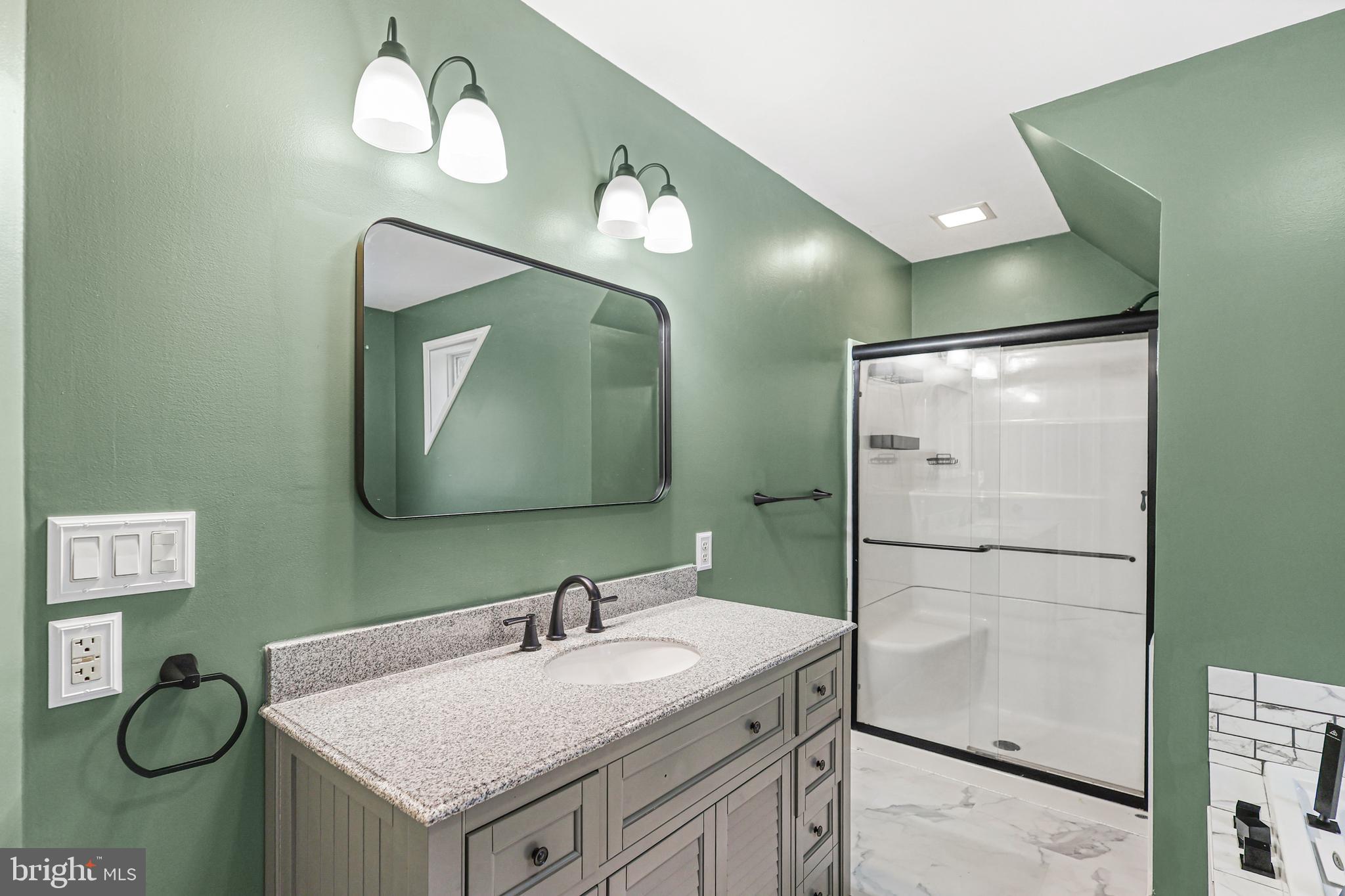 2021 Frostburg Road Frostburg, MD 21532 - Photo 35 of 67 a bathroom with a sink vanity and mirror