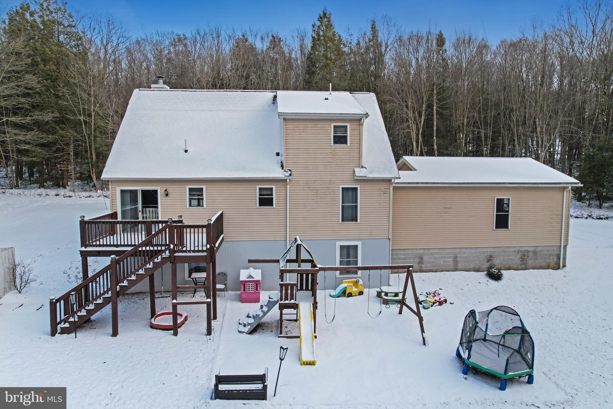 2021 Frostburg Road Frostburg, MD 21532 - Photo 10 of 67 a view of a patio with table and chairs with wooden fence