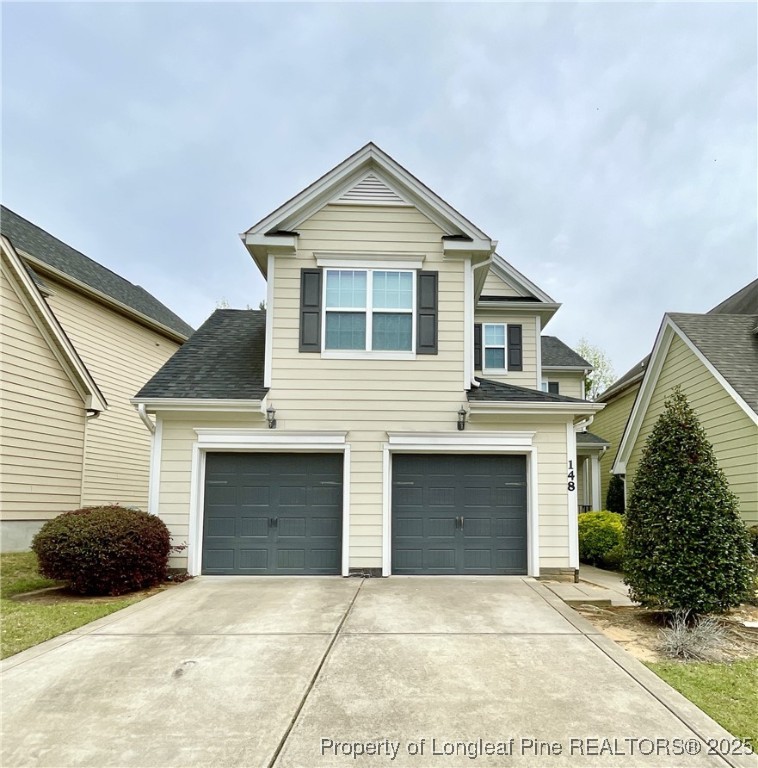 148 Pine Hawk Drive Spring Lake, NC 28390 - Photo 1 of 22 a front view of a house with a garage