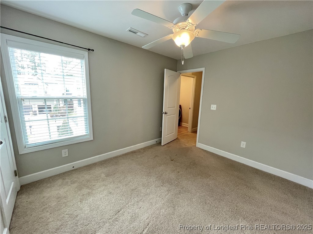 148 Pine Hawk Drive Spring Lake, NC 28390 - Photo 12 of 22 a view of an empty room with a window