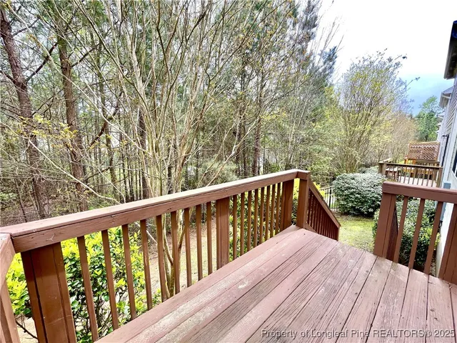 a balcony with wooden floor and wooden floor