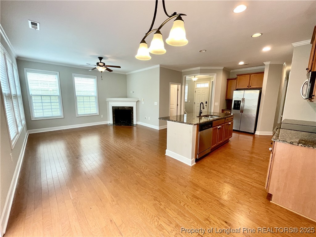 148 Pine Hawk Drive Spring Lake, NC 28390 - Photo 4 of 22 a view of a living room a kitchen and a wooden floor